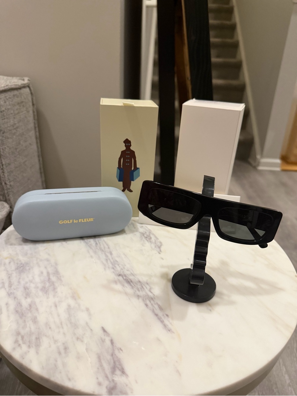 GOLF le FLEUR Bel-Air Sunglasses* in black acetate with a metallic gold logo on